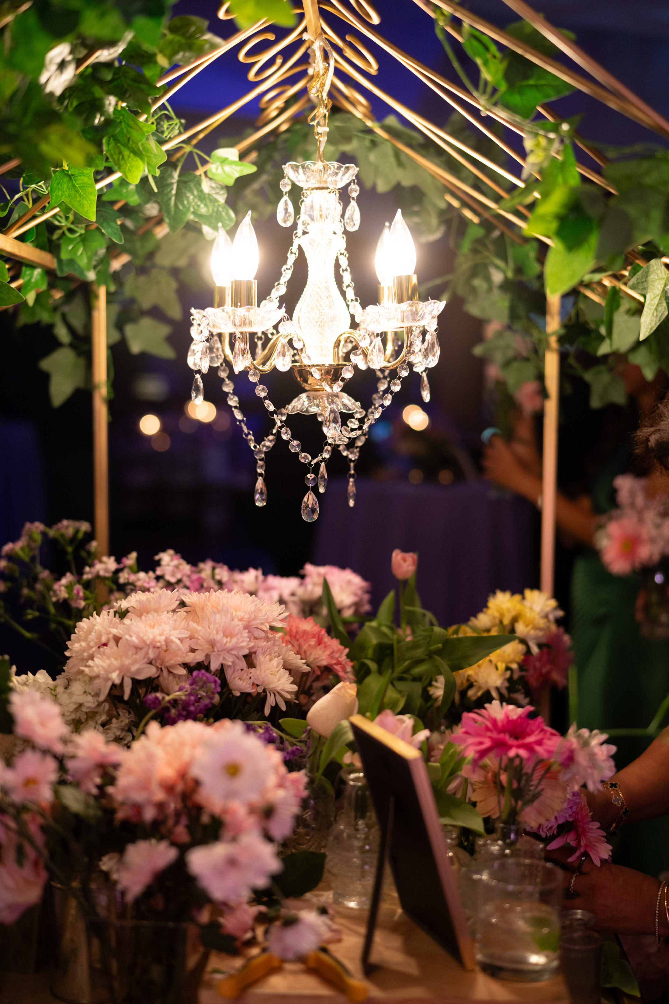 It is all in the attention to detail.  A simple chandelier can really elevate the look of your floral cart.